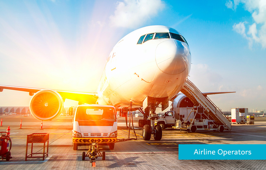 Airplane on an Airfield getting ready for liftoff demonstrating how Hyperwallet helps Airline Operators