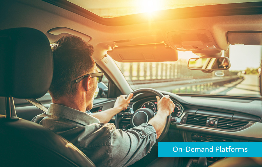 Man driving in a car demonstrating how Hyperwallet helps On-Demand Platforms